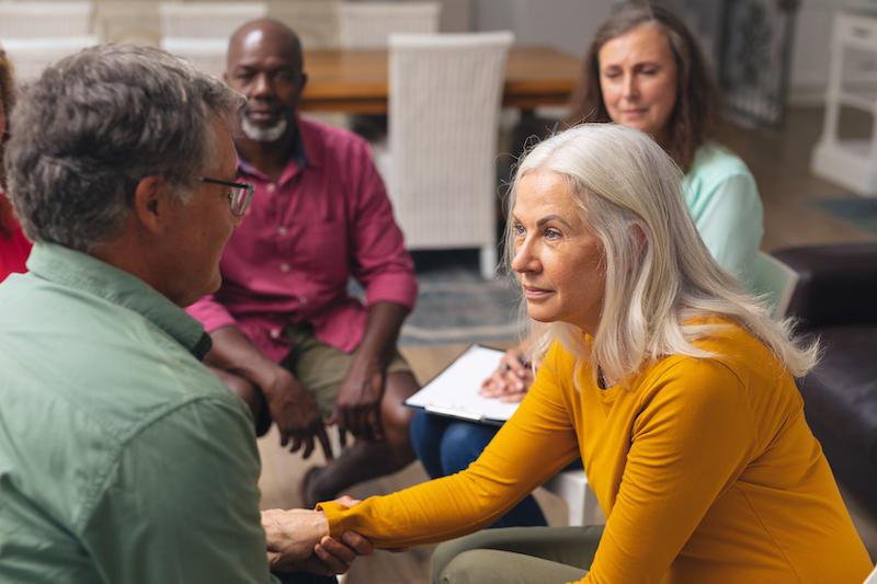 Solicitor guiding a client through writing a will after a dementia diagnosis